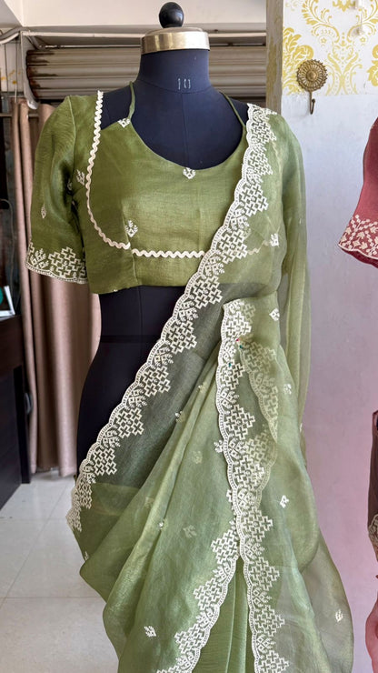 Light green tissue saree with tissue embroidery blouse