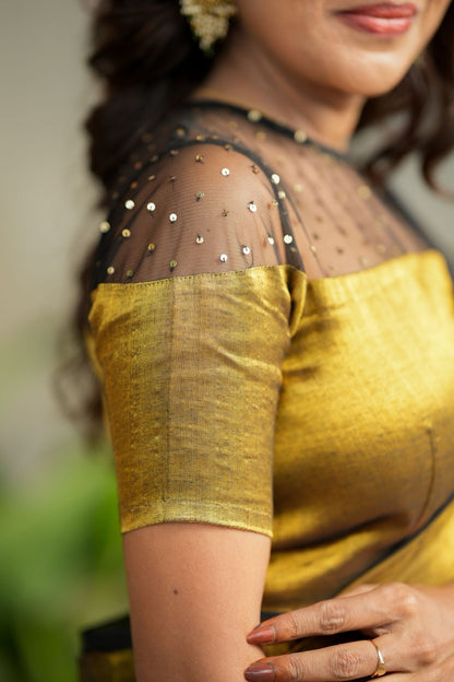 Golden soft tissue saree with hand work blouse