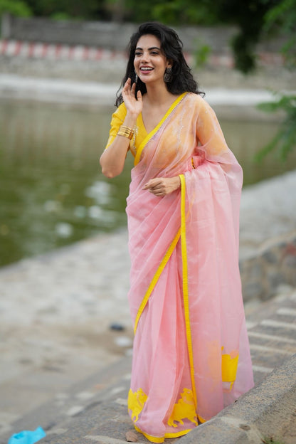 Peach organza saree with yellow hand work blouse