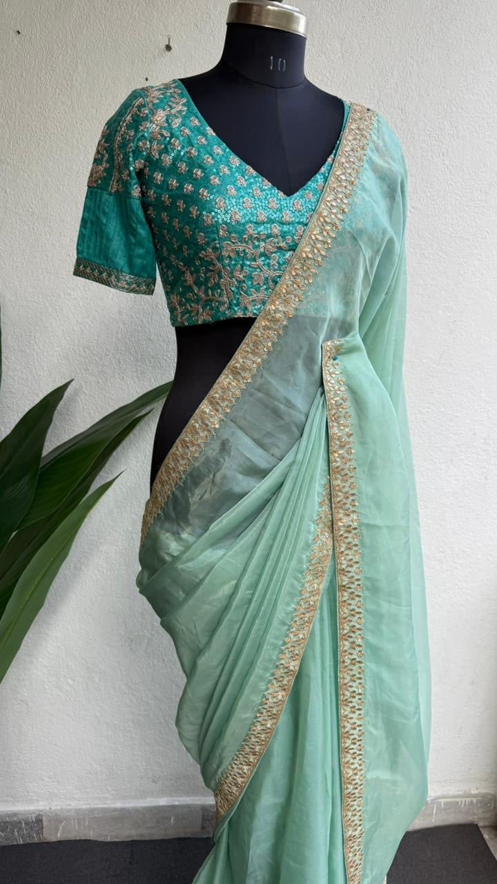 Cyan blue organza saree with blue embroidered blouse