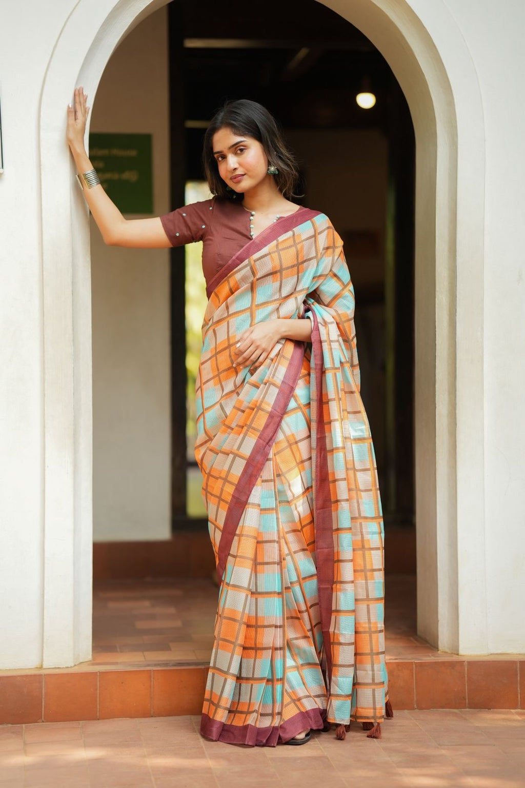 Multi checked kota saree with brown embroidery blouse
