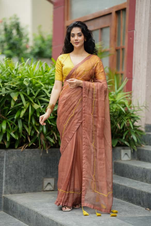 Brown soft organza saree with lime green ikkat blouse