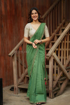 Green mul chanderi saree with halfwhite embroidery blouse