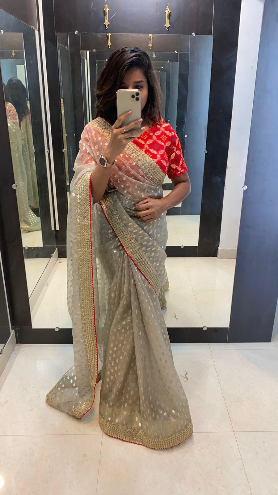 Grey organza printed saree with Stitcehd red Blouse - Threads