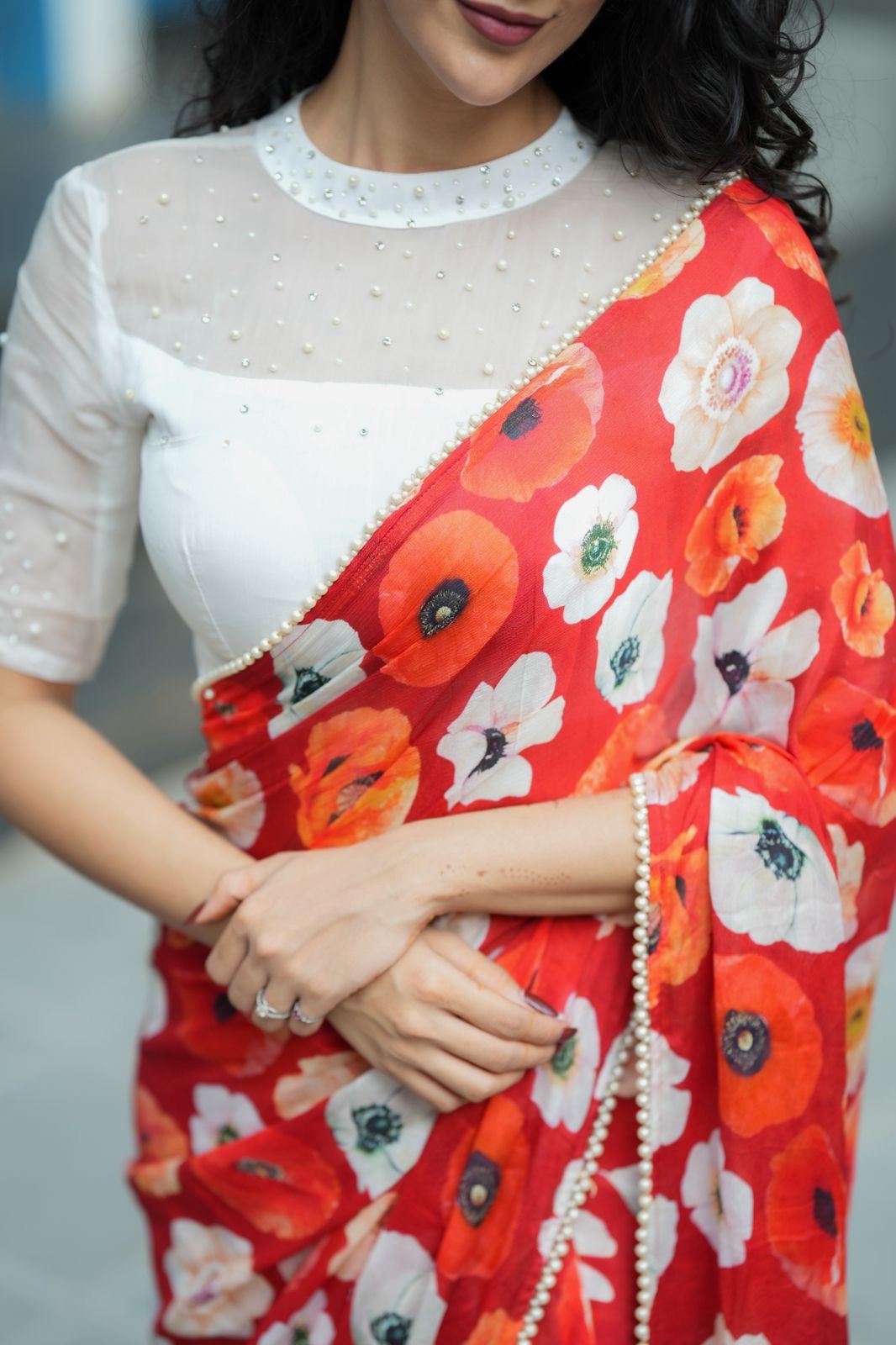 Orange red chinnon silk saree with white organza blouse