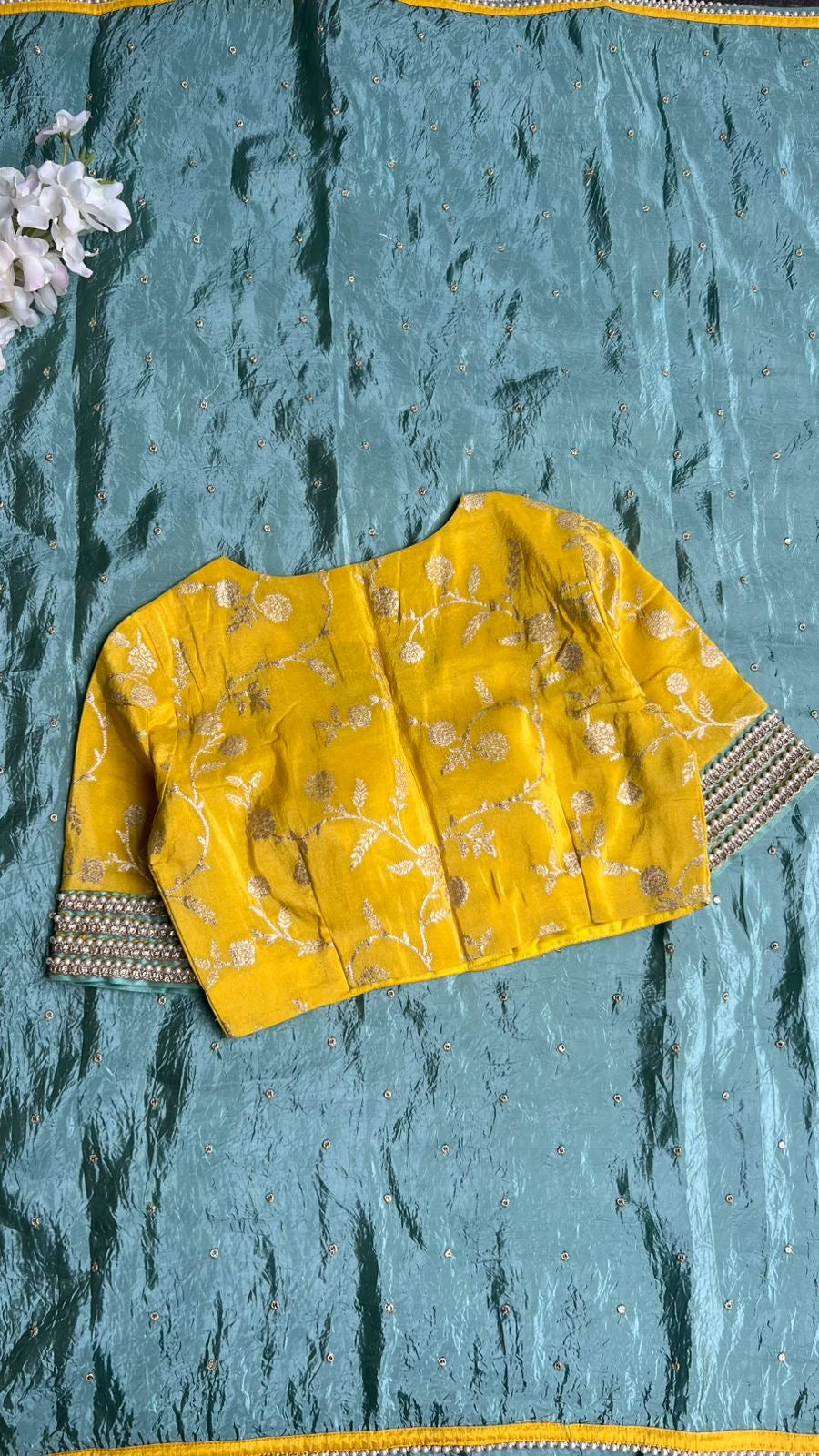 Blue glass tissue saree with yellow banarasi blouse