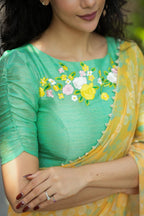 Green tissue floral hand work blouse (only blouse)