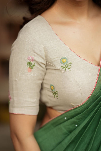 Green mul chanderi saree with halfwhite embroidery blouse