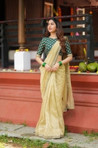 Gold tissue saree with green hand work blouse
