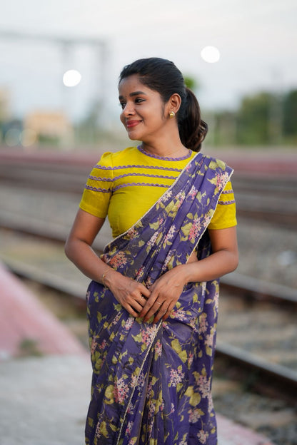 Blue floral tissue saree with lime hand work blouse