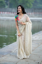 Beige georgette tissue saree with multi hand work blouse