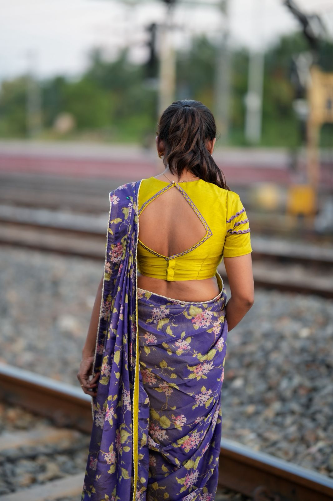Blue floral tissue saree with lime hand work blouse