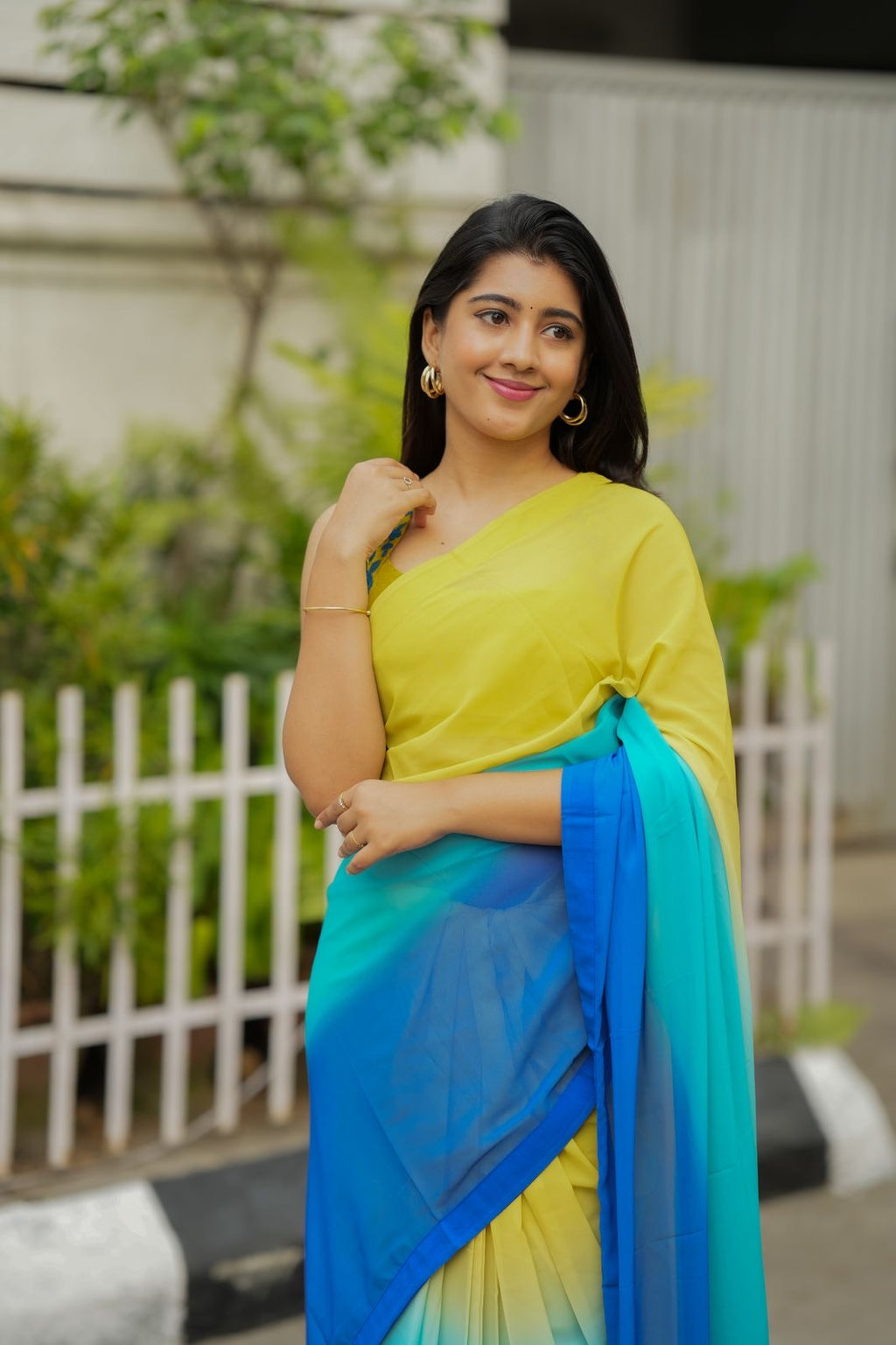 Multi georgette saree with yellow hand made blouse