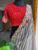 Striped grey organza saree with chiffon embroidery blouse - Threads