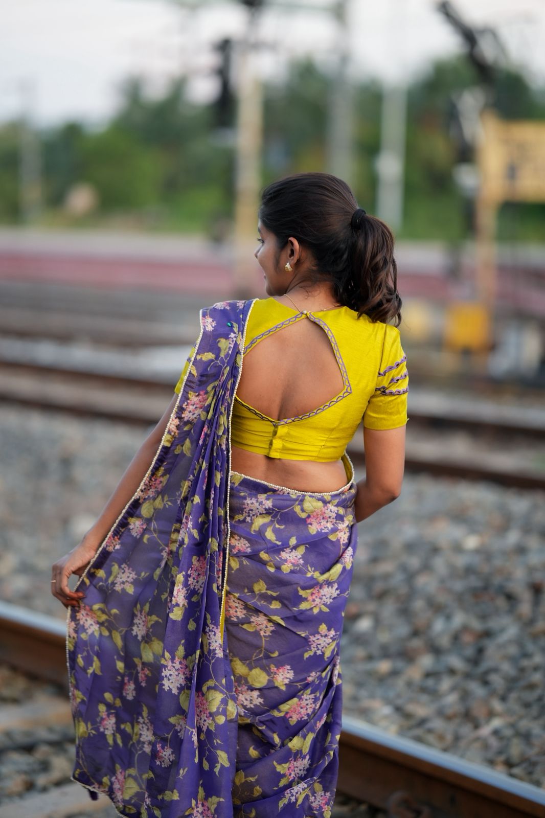 Blue floral tissue saree with lime hand work blouse