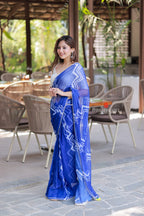 Blue chiffon saree with white embroidery blouse