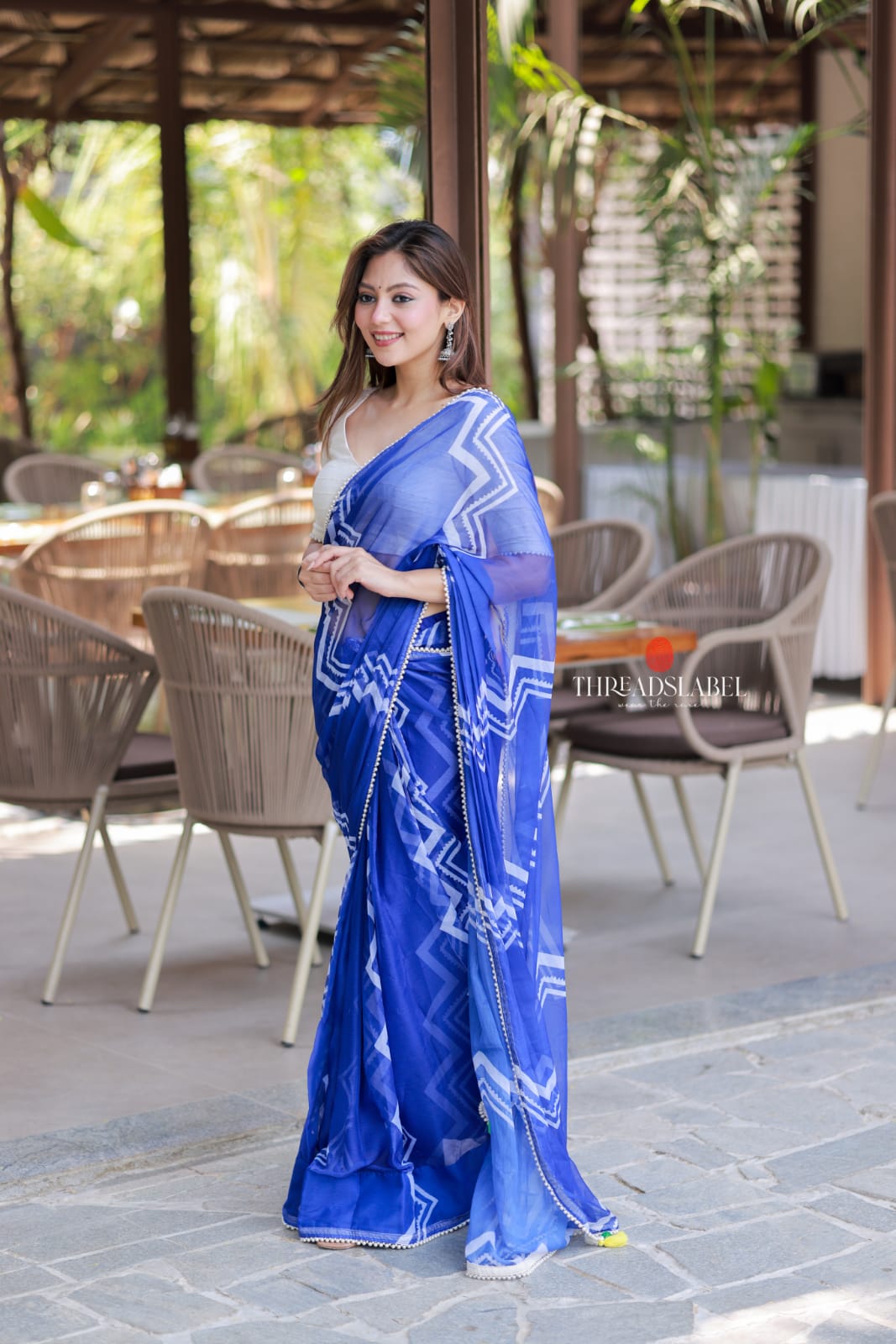 Blue chiffon saree with white embroidery blouse