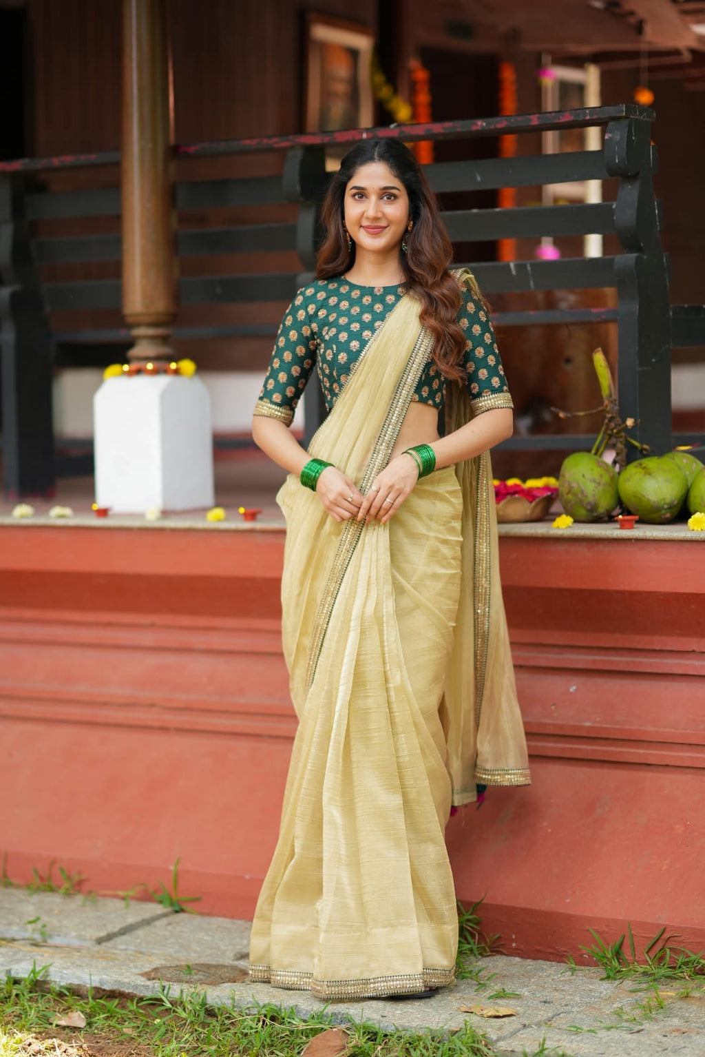 Gold tissue saree with green hand work blouse