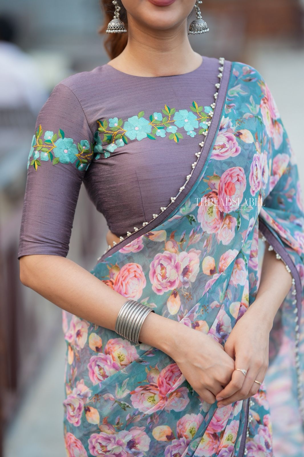 Blue floral georgette saree with grey embroidery blouse