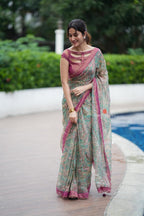 Jade green viscose jute saree with pink tissue blouse