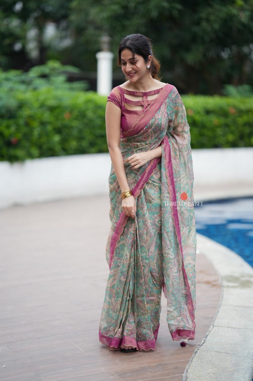 Jade green viscose jute saree with pink tissue blouse
