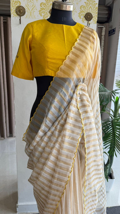 Yellow & cream stripped tissue saree with bird work blouse