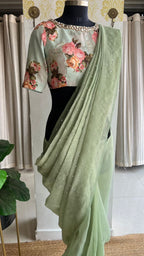 Light green tissue saree with mirror floral blouse