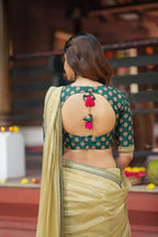 Gold tissue saree with green hand work blouse