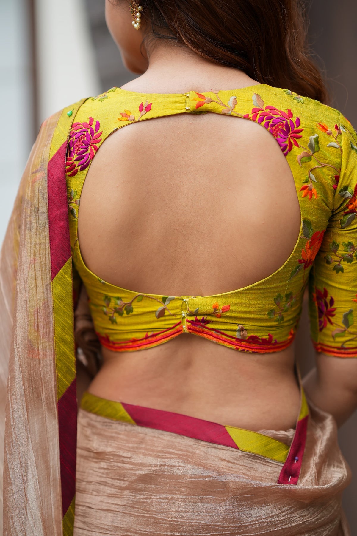 Antique gold tissue saree with parrot handwork blouse