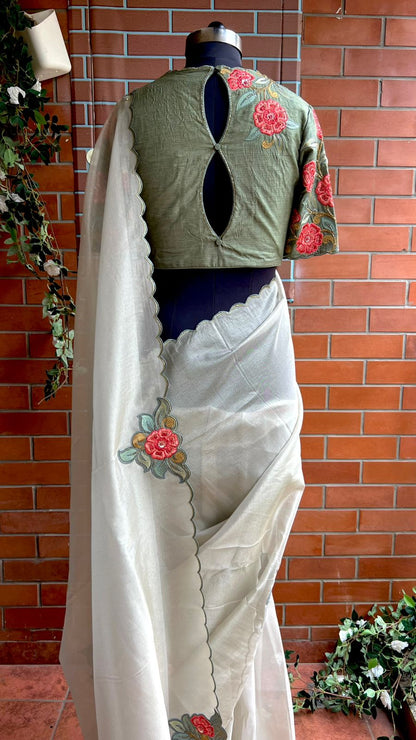 Half white textured organza saree with heavy handwork blouse