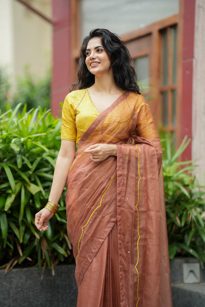 Brown soft organza saree with lime green ikkat blouse