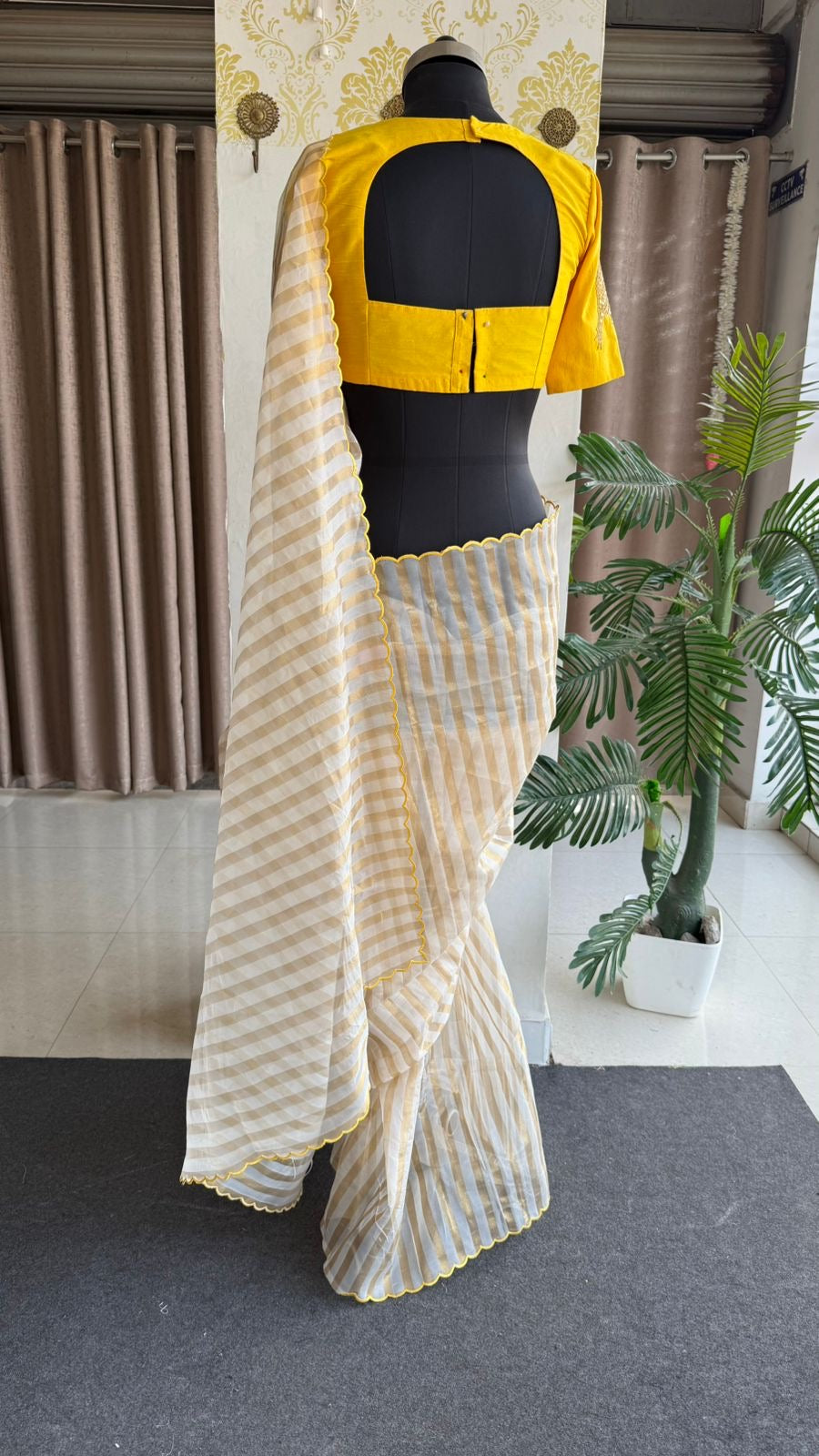 Yellow & cream stripped tissue saree with bird work blouse