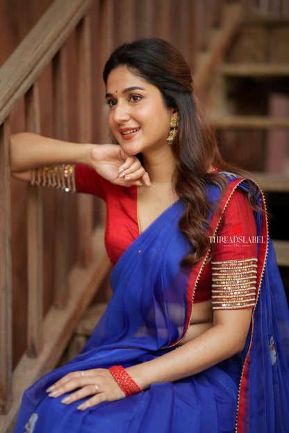 Blue organza cow with red hand work blouse