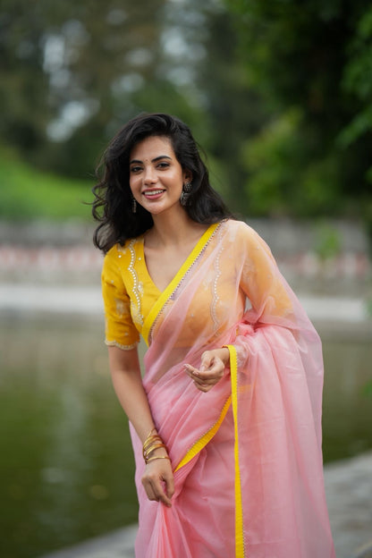 Peach organza saree with yellow hand work blouse
