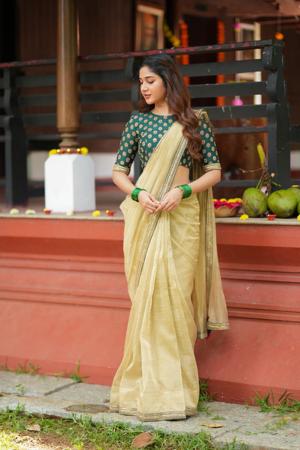 Gold tissue saree with green hand work blouse