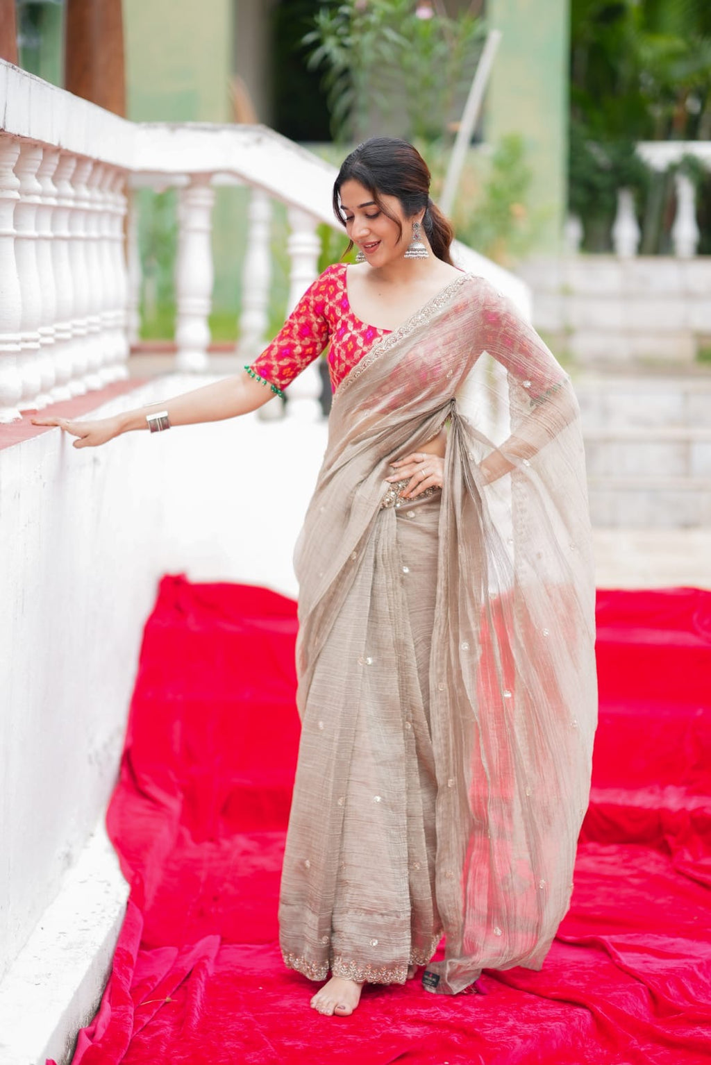 Grey tissue saree with red banarasi blouse