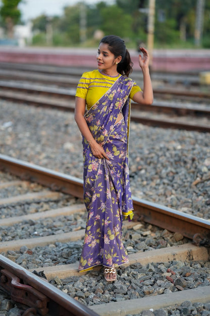 Blue floral tissue saree with lime hand work blouse
