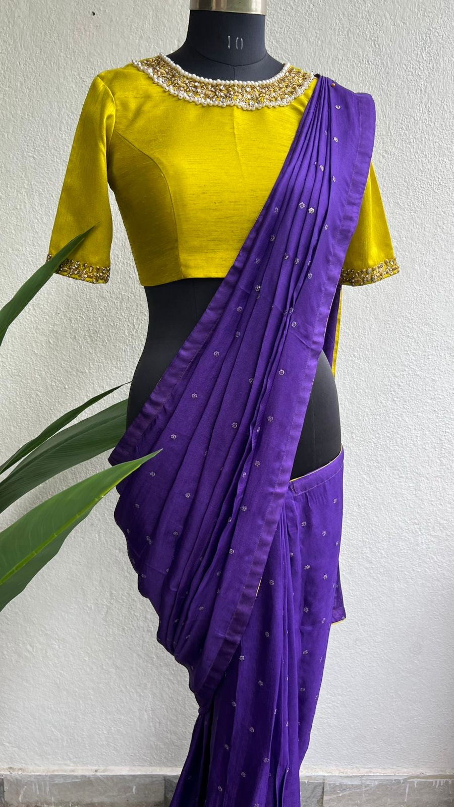 Purple soft jute saree with yellow JEWEL neck hand work blouse