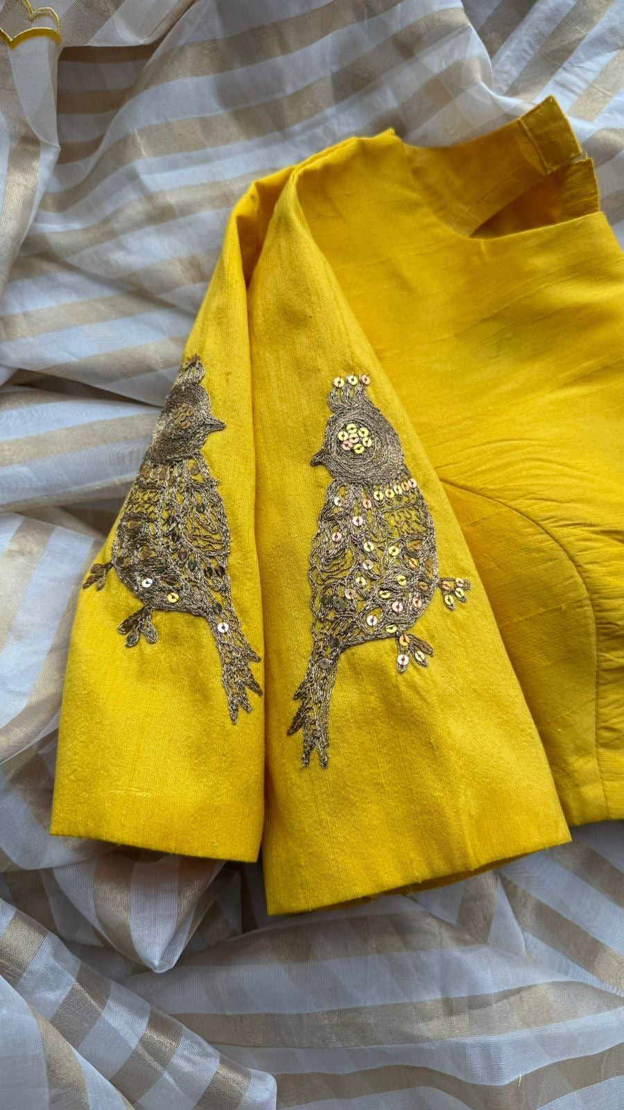 Yellow & cream stripped tissue saree with bird work blouse