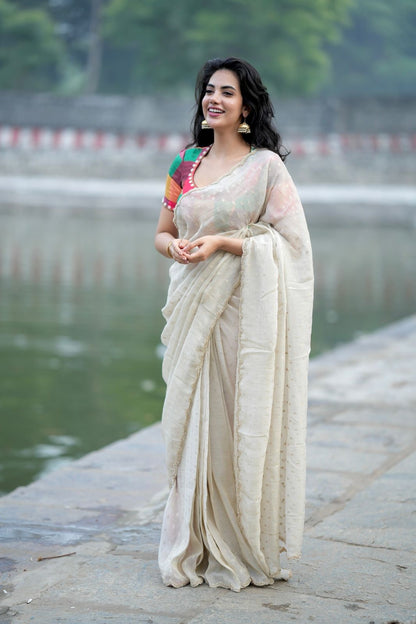 Beige georgette tissue saree with multi hand work blouse