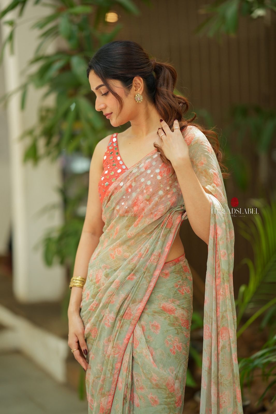 Western green chiffon saree with mirror work blouse