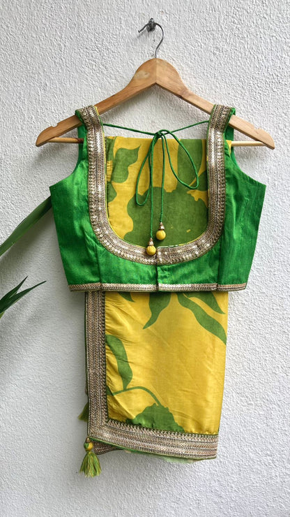 Yellow viscose saree with green silk embroidered blouse