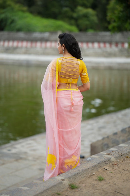 Peach organza saree with yellow hand work blouse