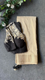 Golden cream tissue saree with black hand work blouse