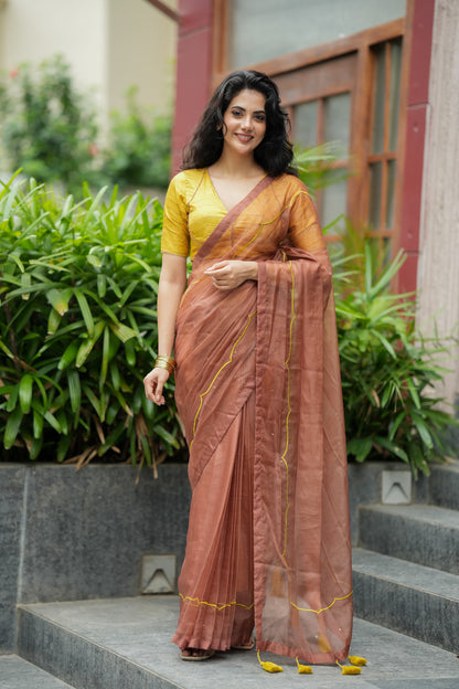 Brown soft organza saree with lime green ikkat blouse