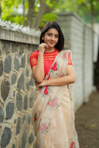 Glossy organza saree with red embroidery blouse