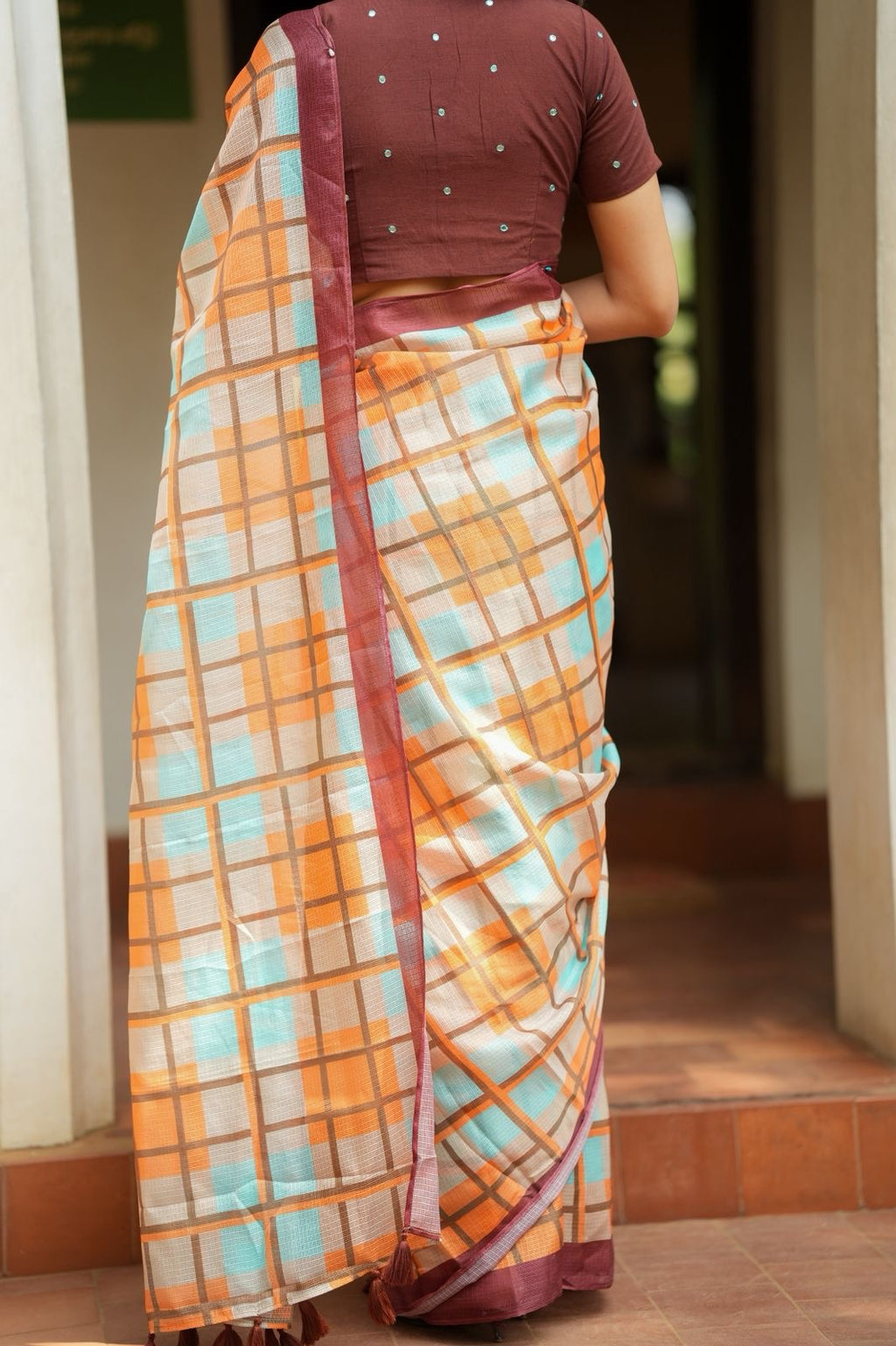 Multi checked kota saree with brown embroidery blouse