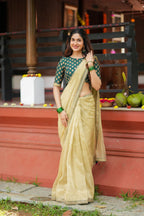Gold tissue saree with green hand work blouse