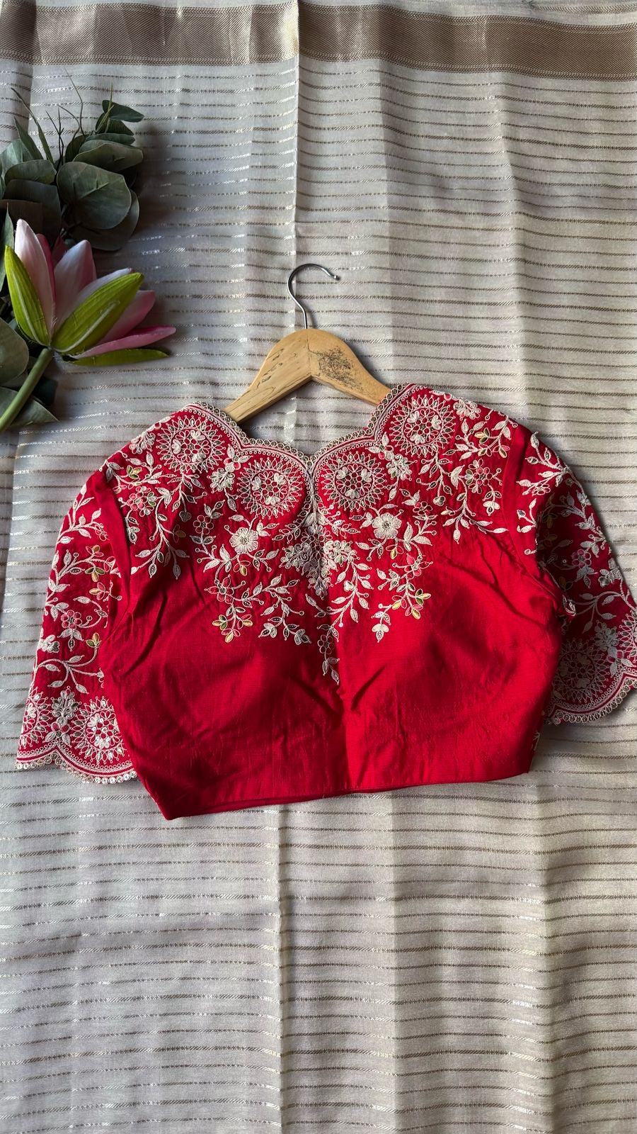 Cream tissue stripped saree with red silk hand work blouse