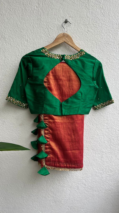 Red tissue saree with green hand work blouse